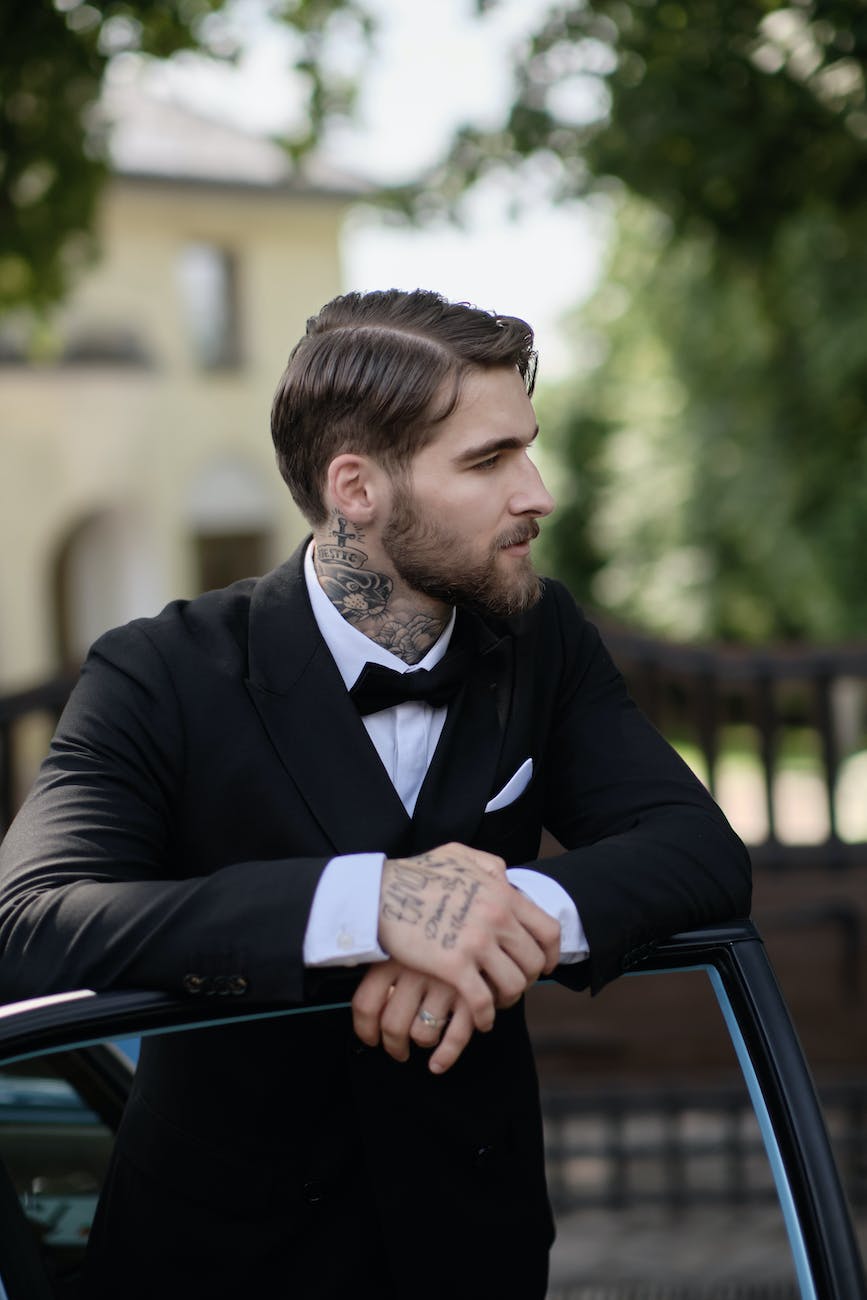 tattooed man in a suit